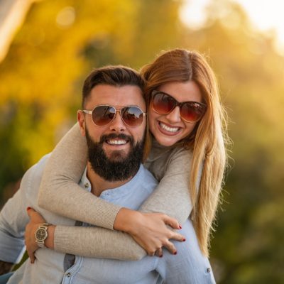 clinton township couple smiling after teeth whitening at shelby township dentist